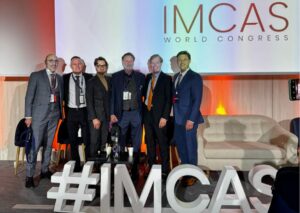 Dr Bessam Farjo on stage at IMCAS 2025 conference in Paris.