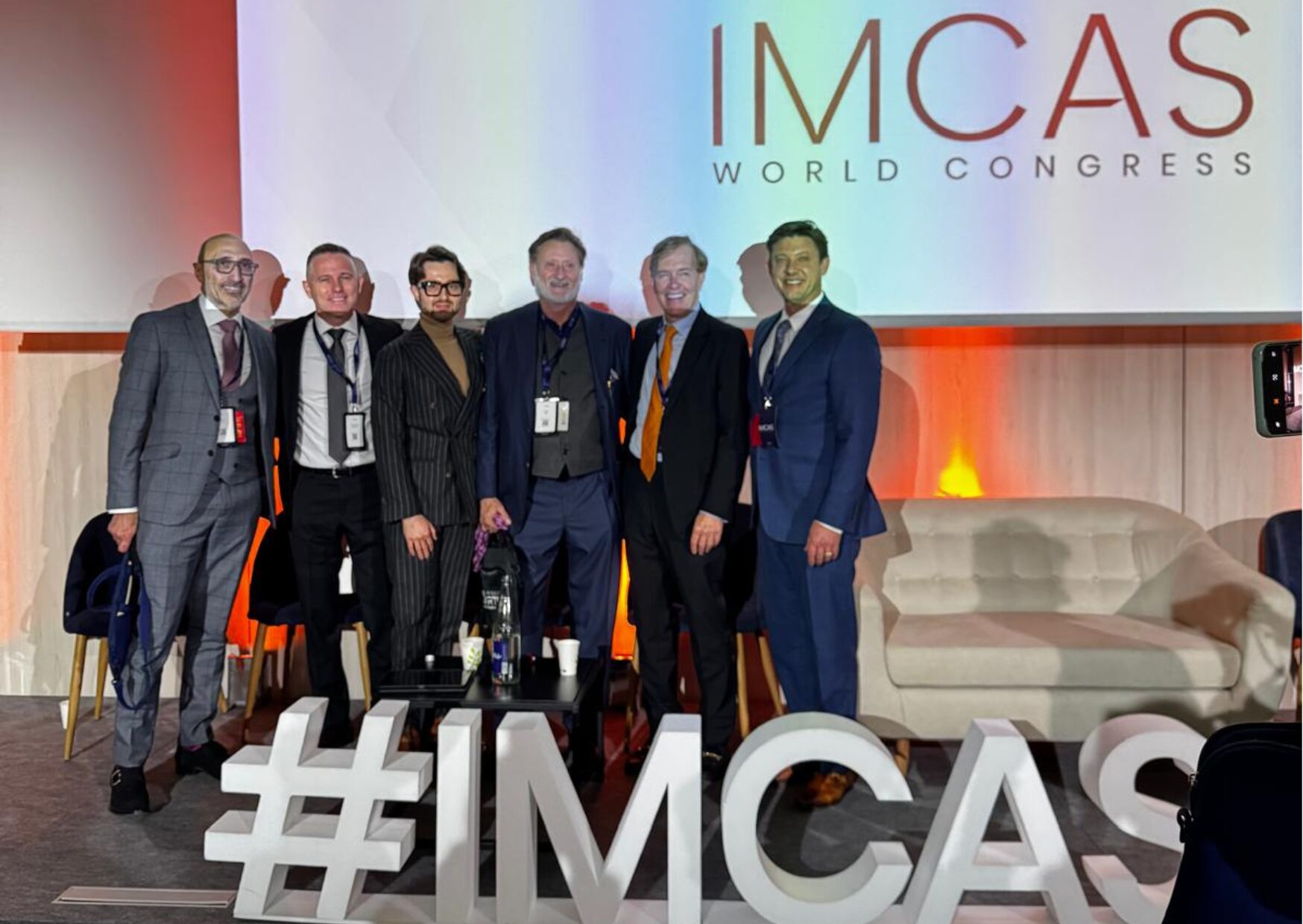 Dr Bessam Farjo on stage at IMCAS 2025 conference in Paris.