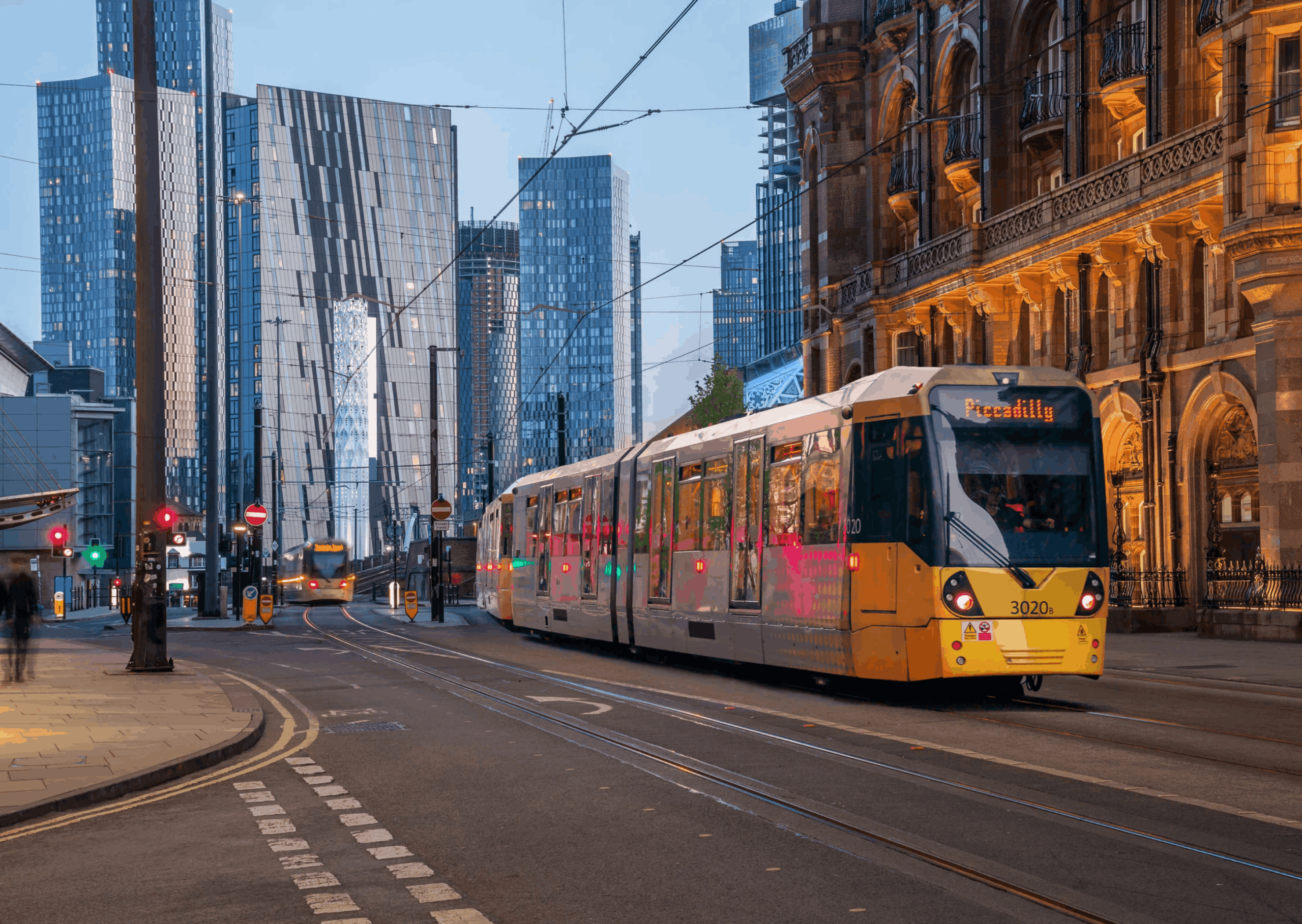 Image of Manchester tram driving through central Manchester